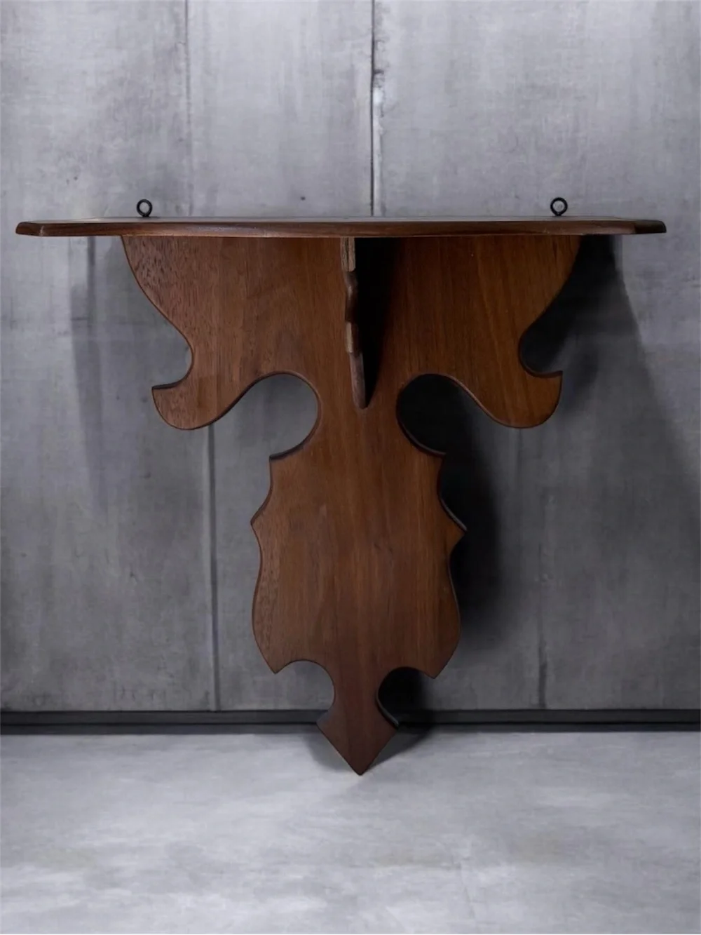vintage wall sconce shelf made of carved wood with a dark finish